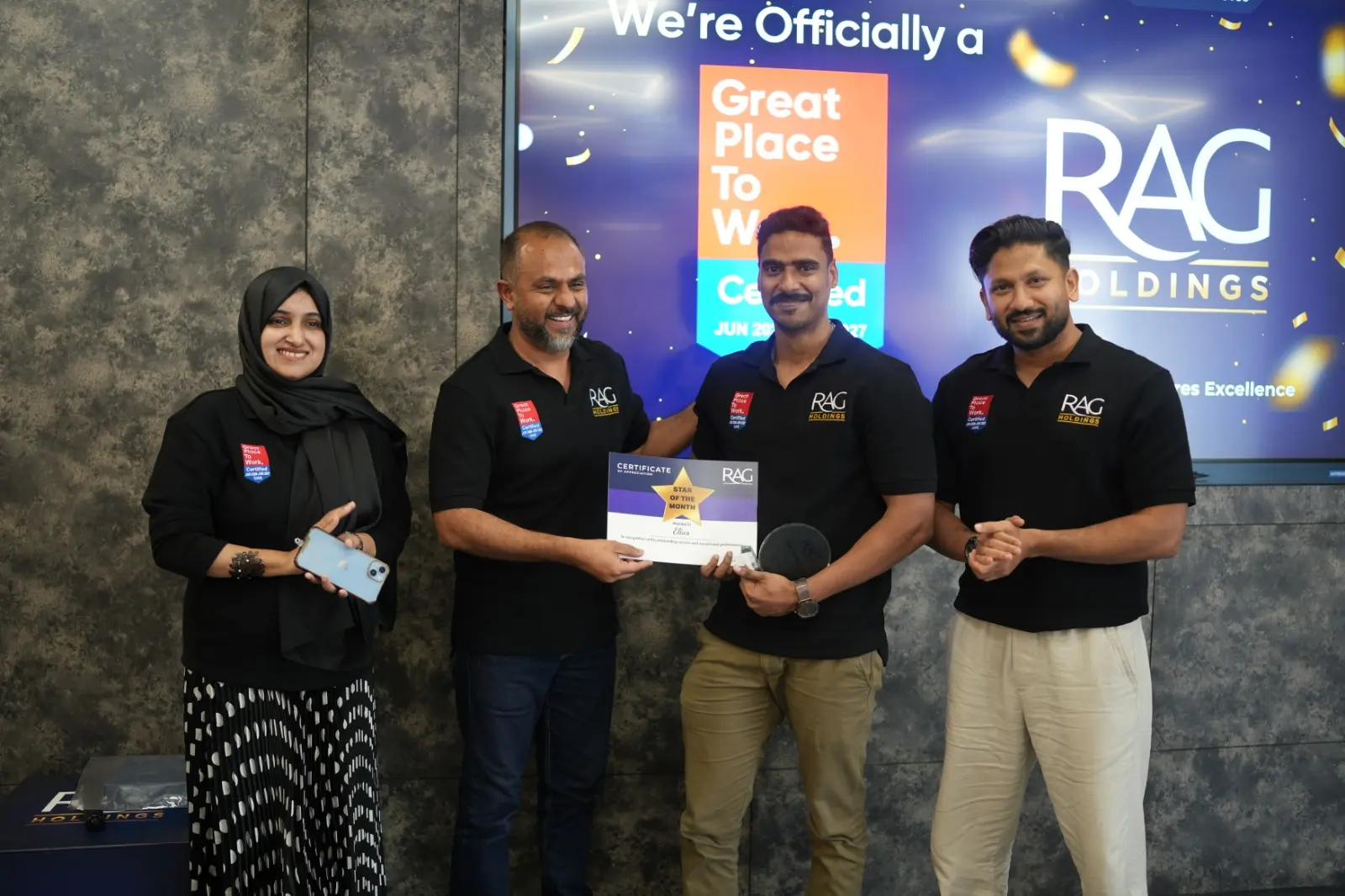 Team members at RAG Holdings fostering collaboration, trust, and workplace excellence.